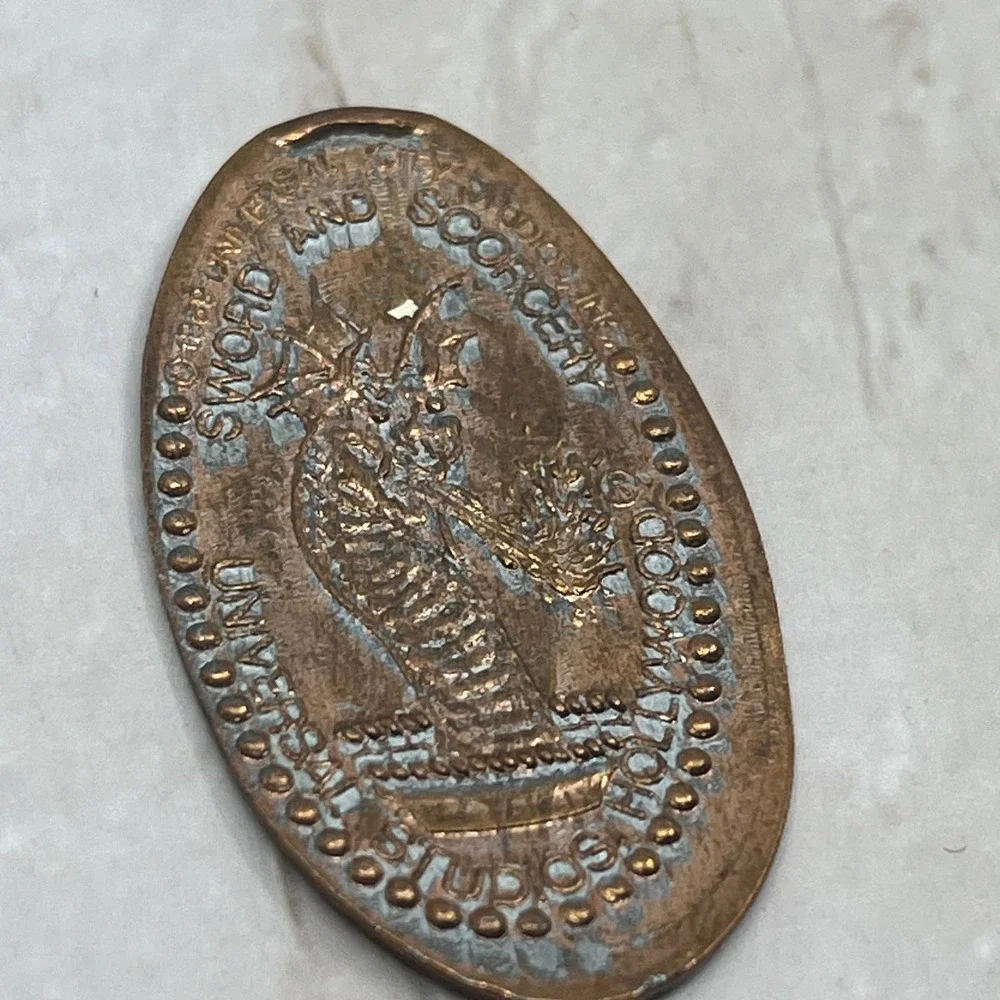 Vtg Swords and Sorcery Universal Studios Hollywood Souvenir Stamped Penny SB8 - Picture 2 of 2